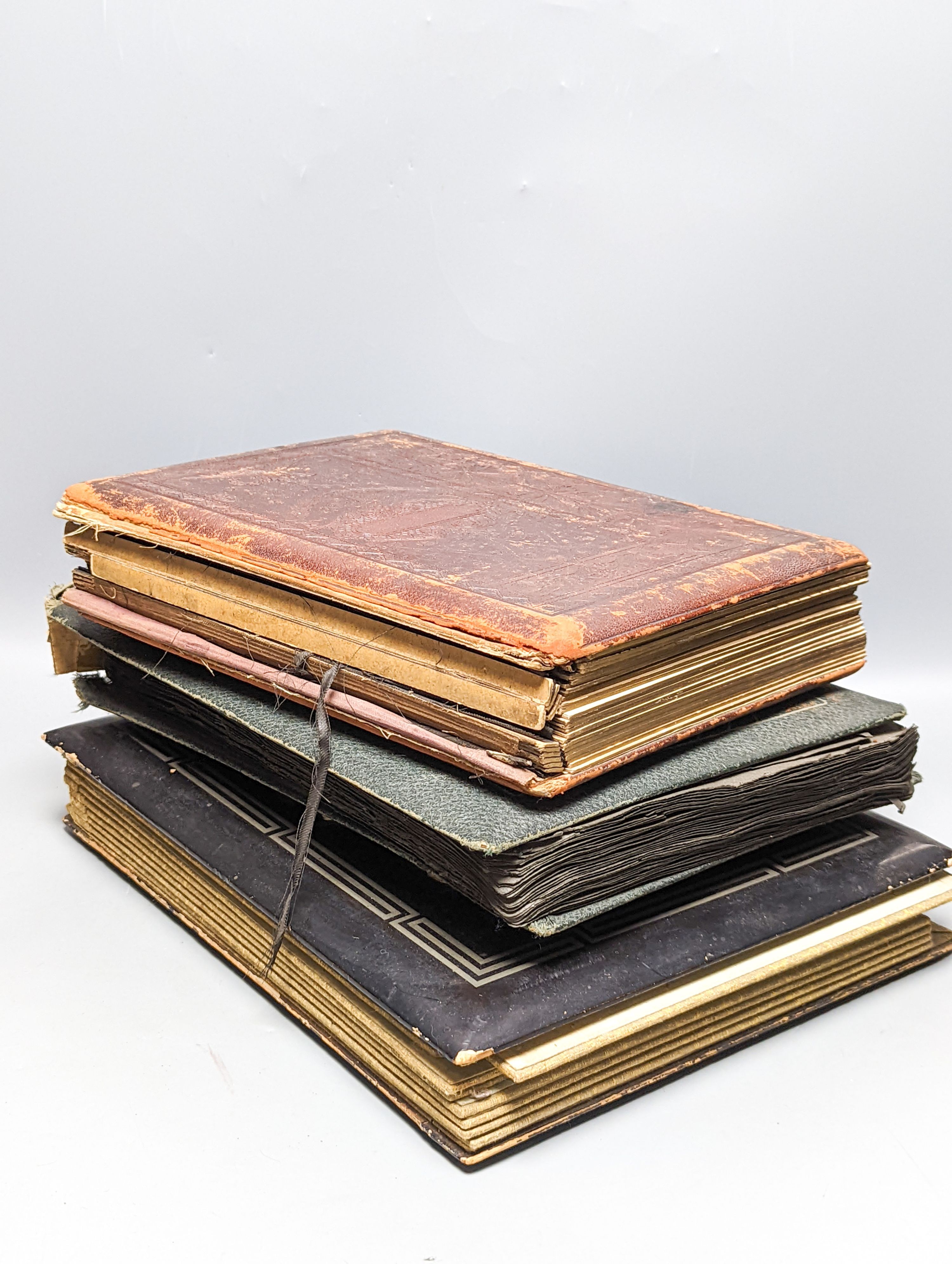 Two early 20th century postcard albums, a photo album and a collection of loose postcards